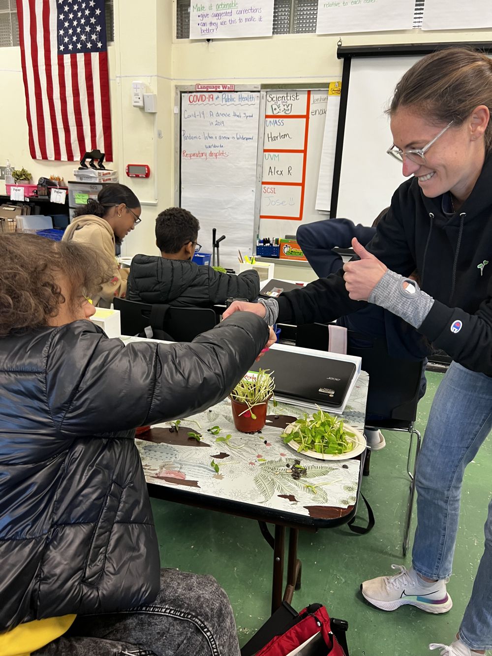 Boston students visiting an indoor microgreens farm